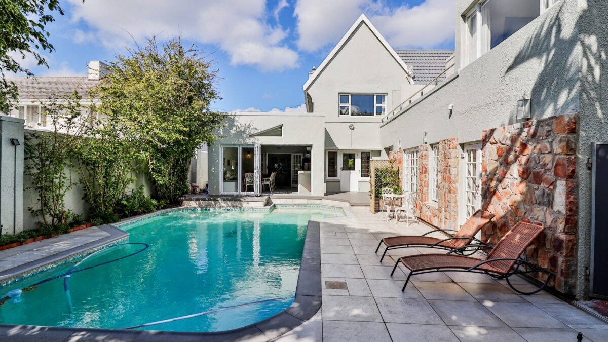 Swimming pool and sun loungers at Wholeness Accommodation