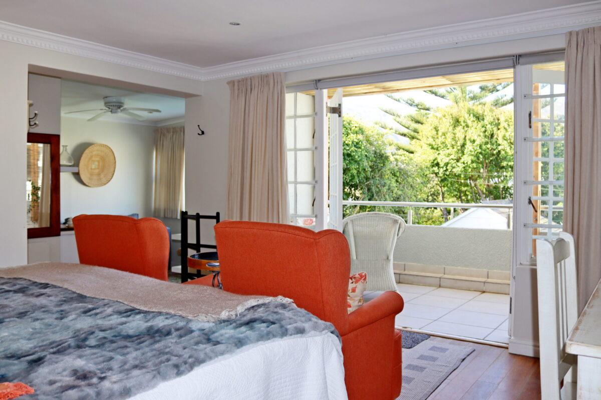 Mountain Suite bedroom opening onto the covered balcony